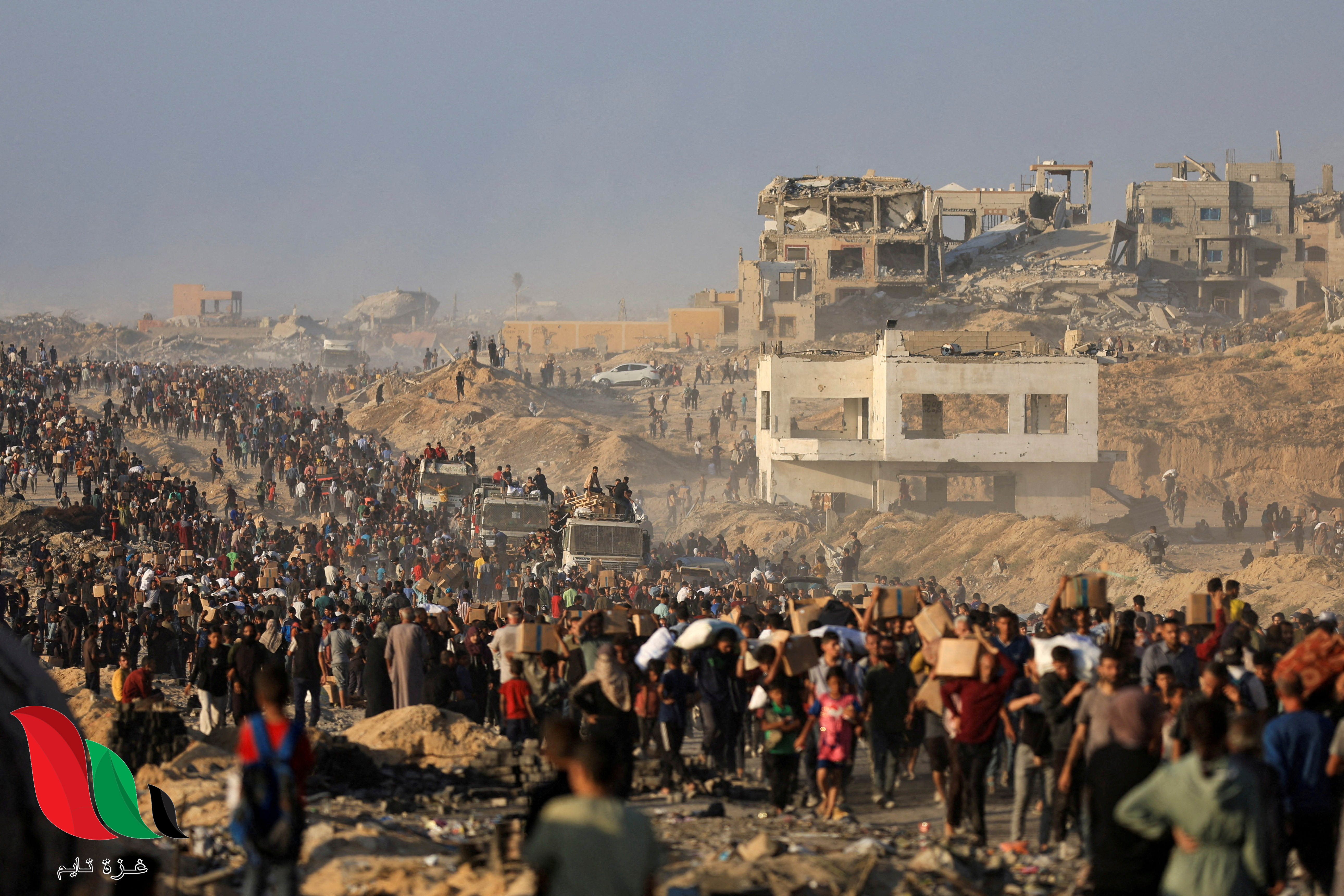 FILE PHOTO: Palestinians gather to receive aid supplies in Beit Lahia, in the northern Gaza Strip, June 16, 2025. REUTERS/Dawoud Abu Alkas/File Photo